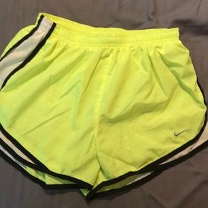 Neon yellow Nike running shorts, medium